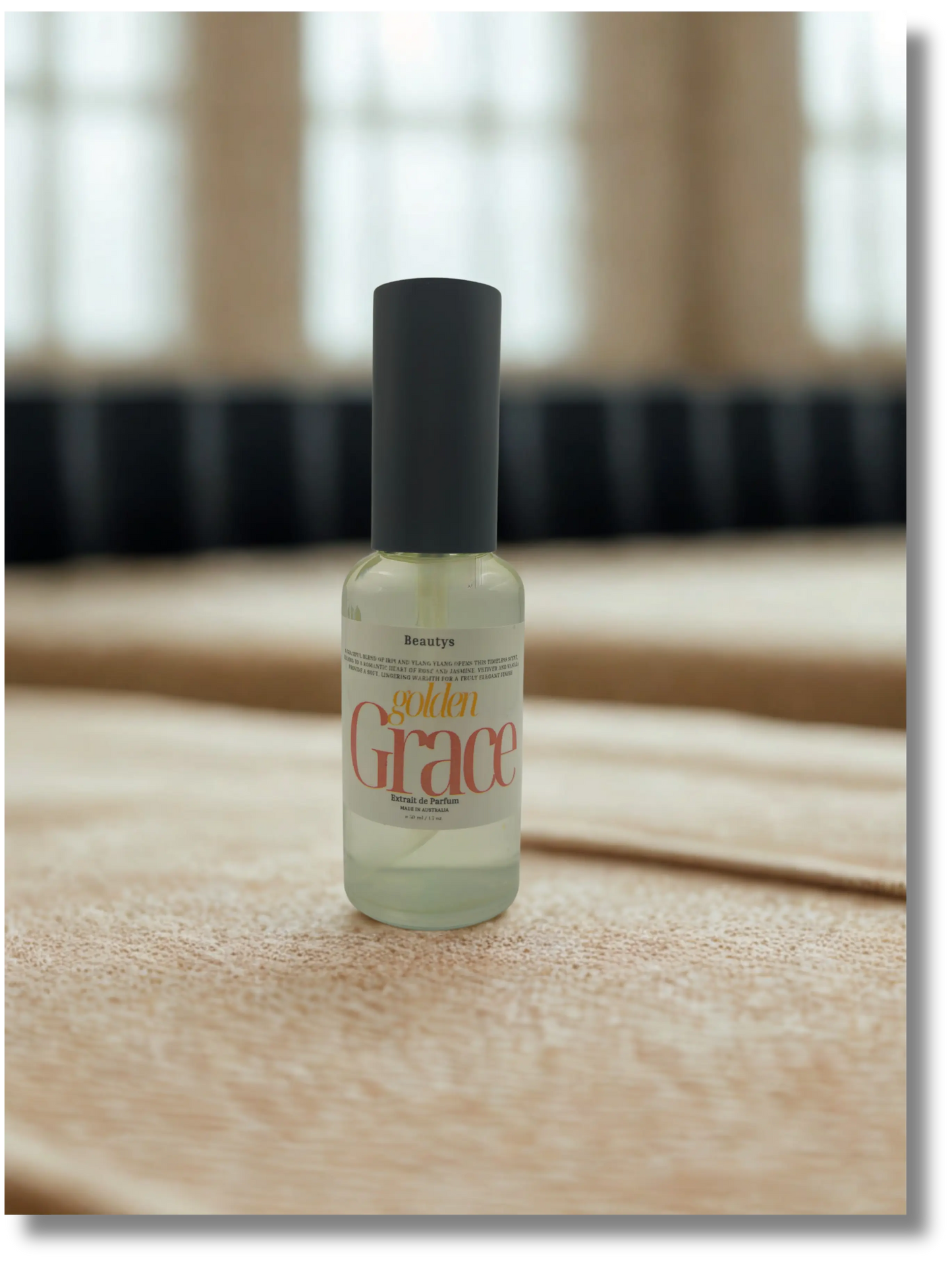 Golden Grace perfume by Beautys, elegant glass bottle with gold accents, showcasing a luxurious fragrance.