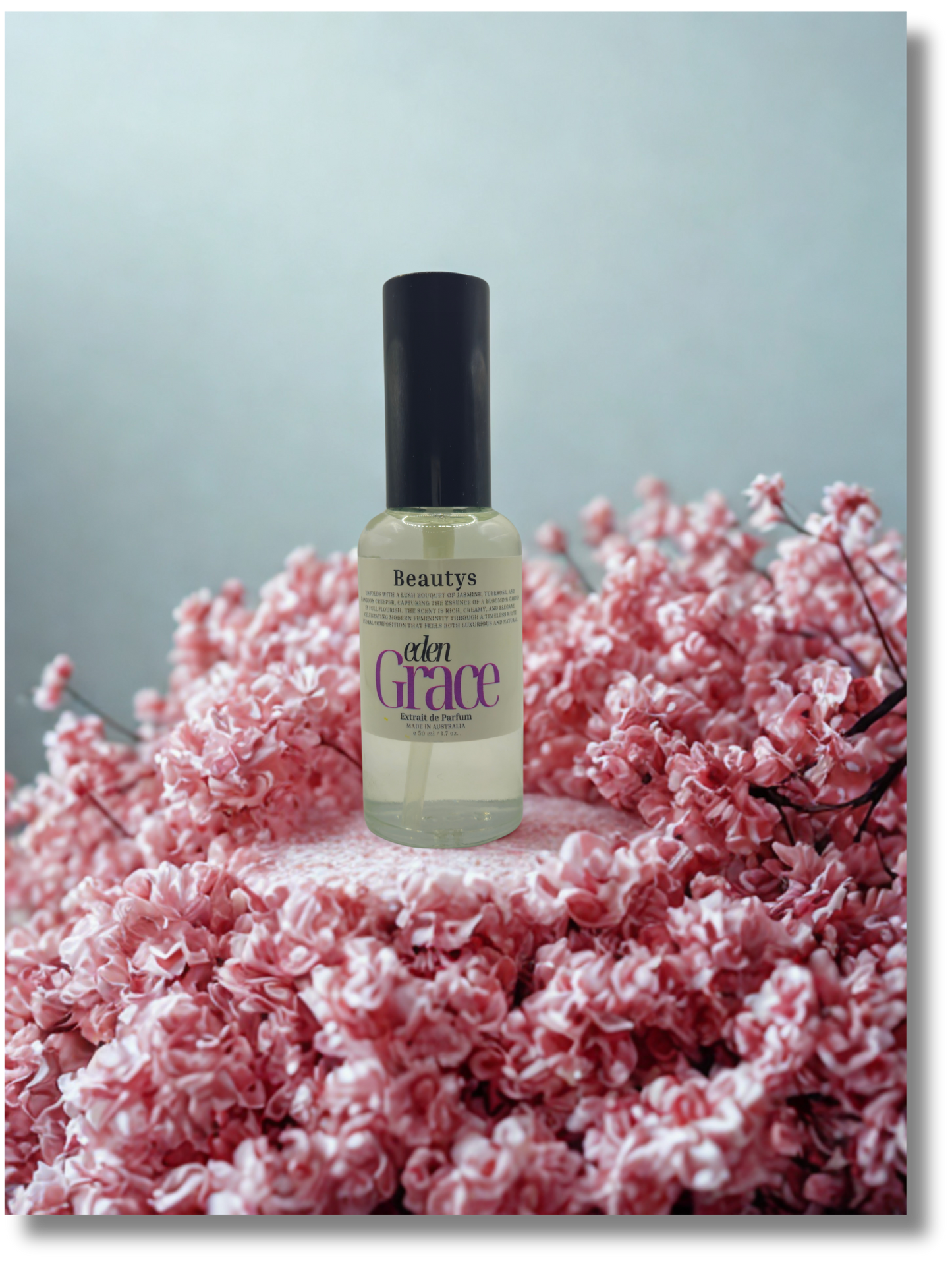 Beautys Eden Grace perfume displayed with white florals, Tasmanian-made feminine scent.