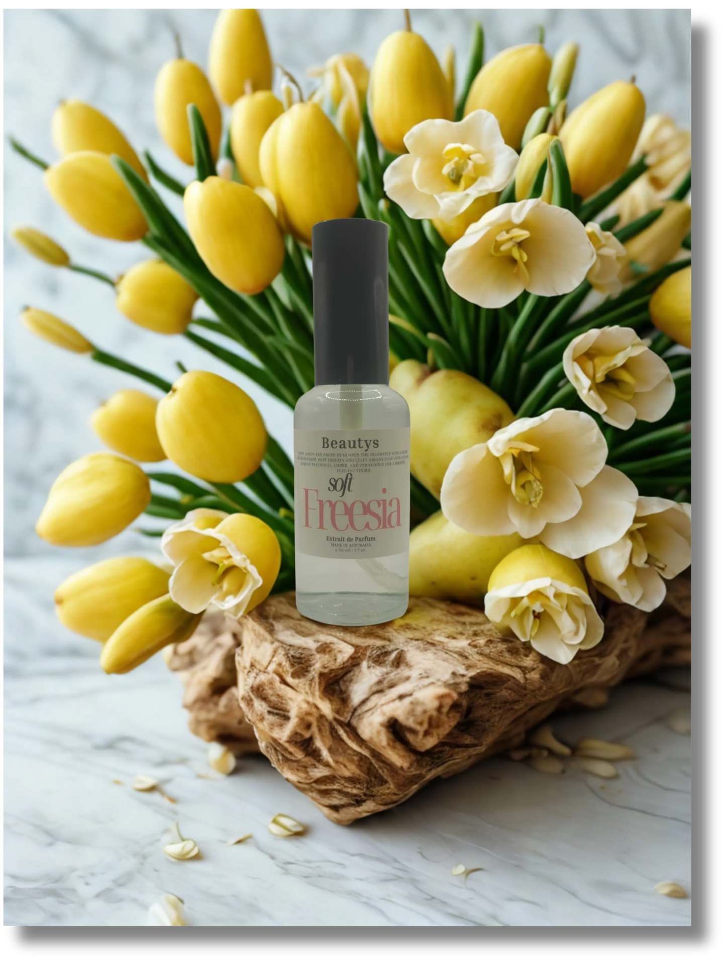 Soft freesia flower from Beautys, featuring delicate petals in pastel shades with lush green leaves.