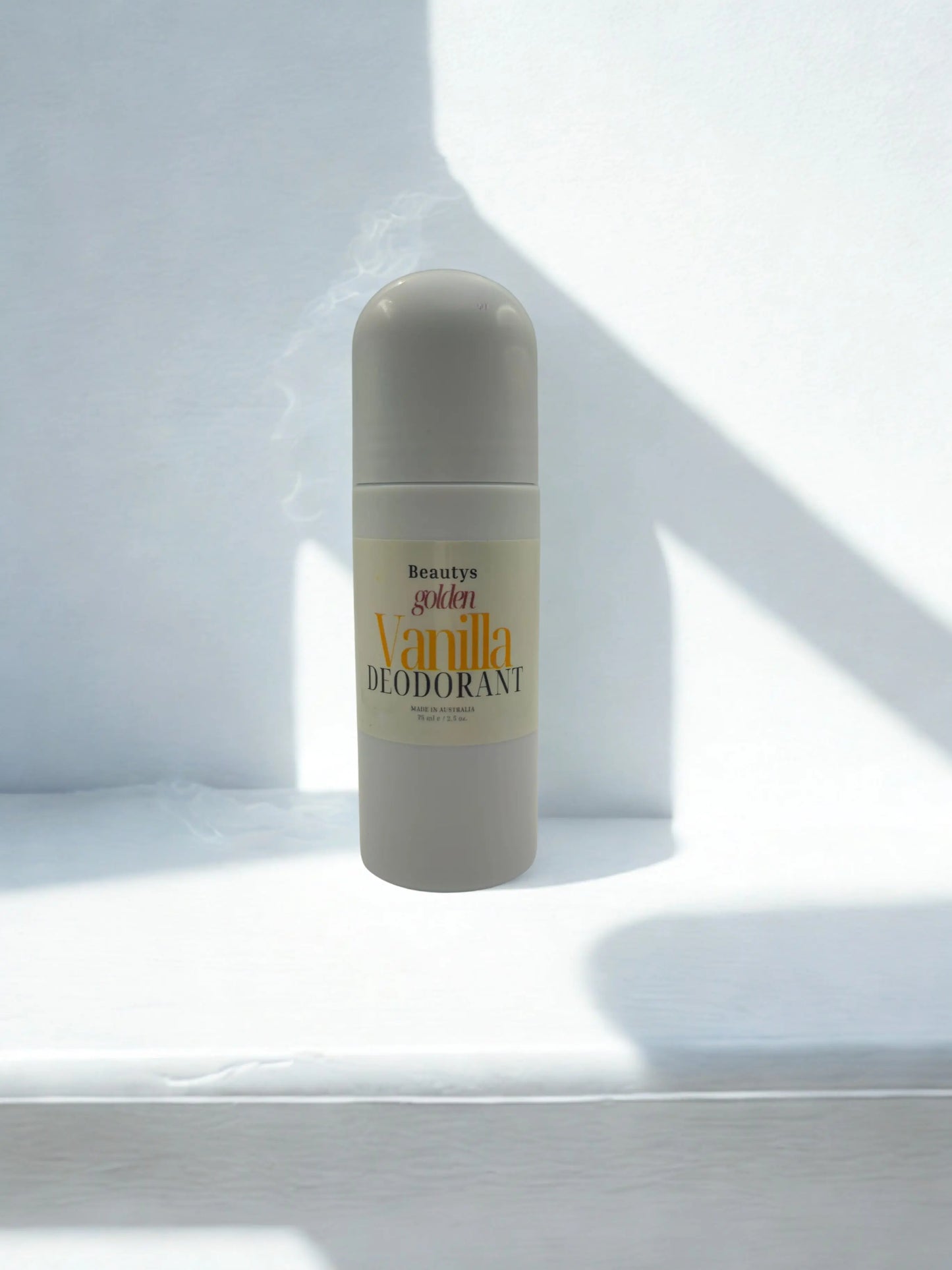 Beautys Golden Vanilla Roll-On Deodorant bottle with clear cap and golden vanilla scent label, shown on a white background.
