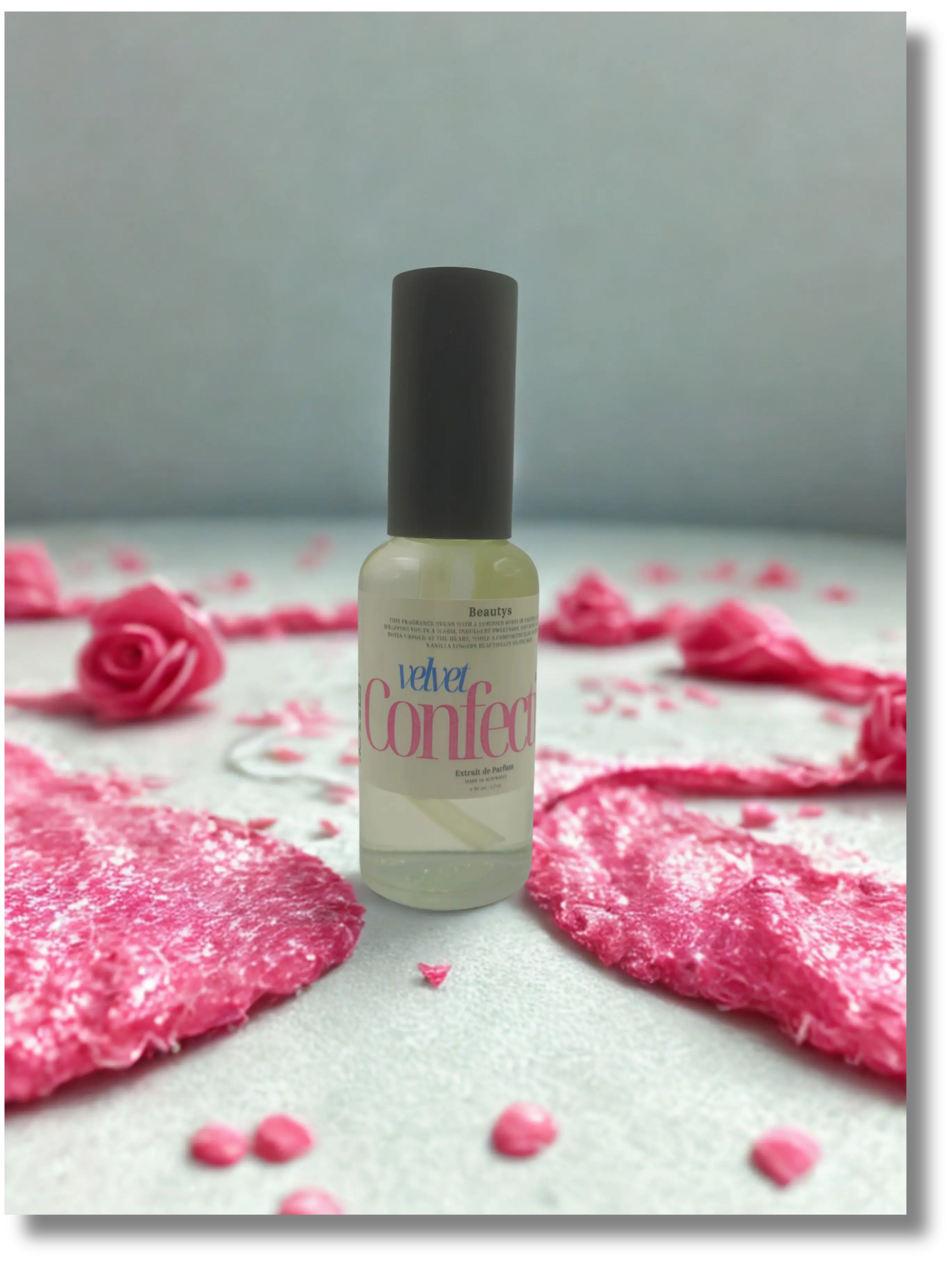 Beautys Velvet Confection perfume bottle with a sleek design and elegant velvet accents on a neutral background.