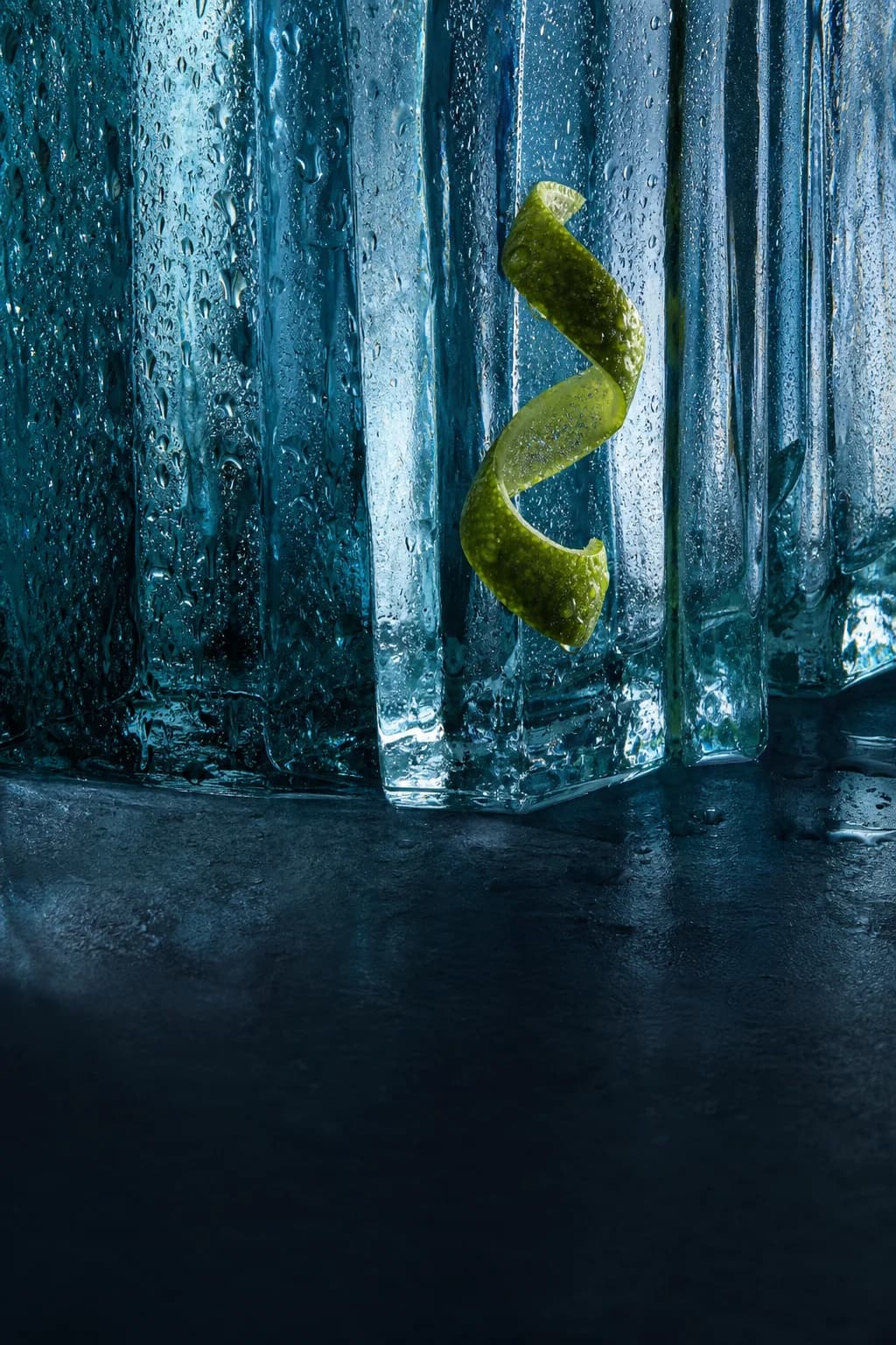 Editorial study of cool glass, citrus and water