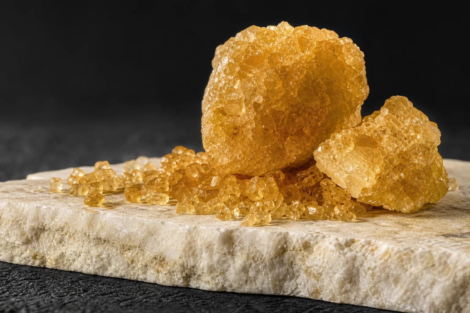 Golden brown sugar crystals and a broken sugar lump