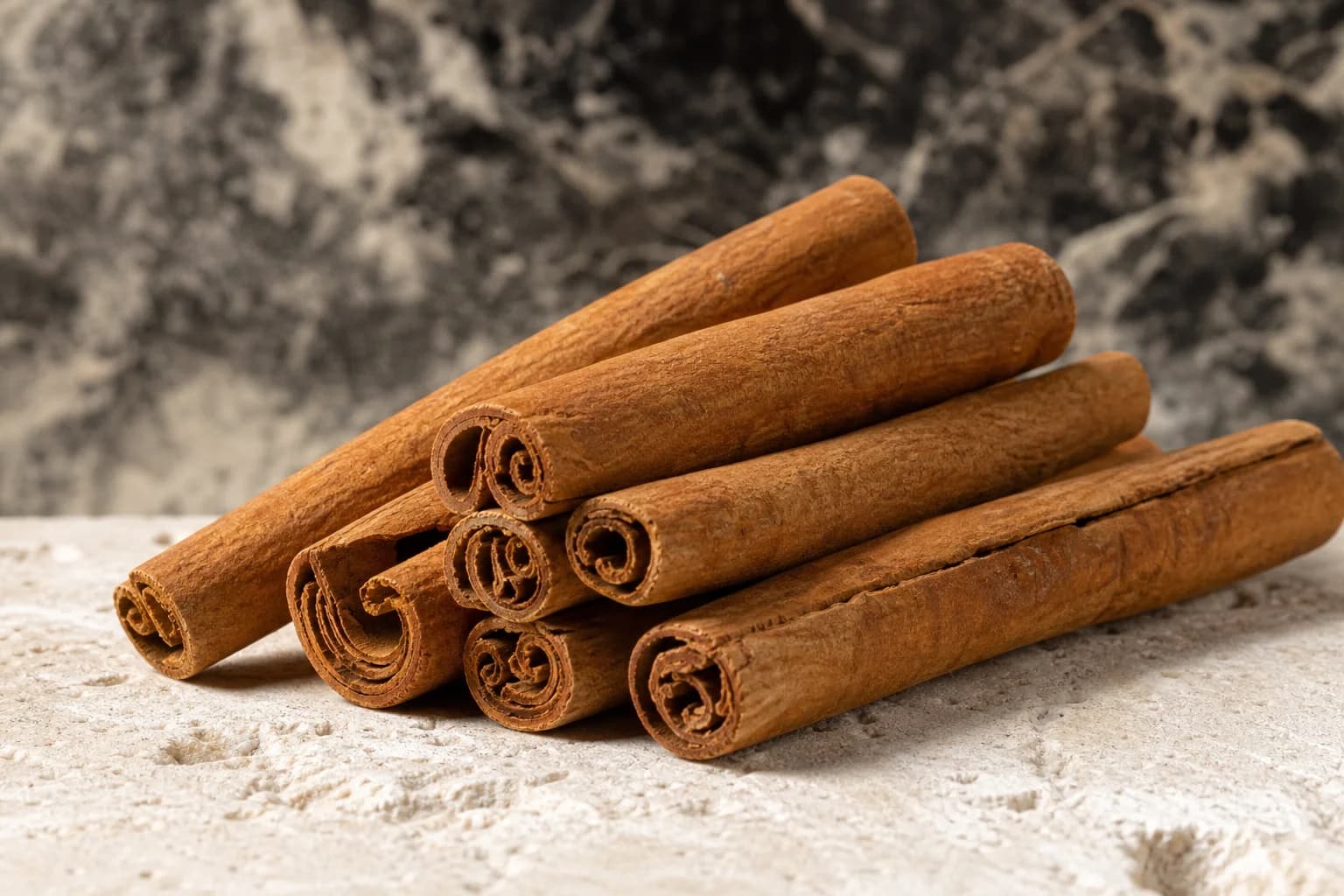 Curled cinnamon bark quills with fine layered texture