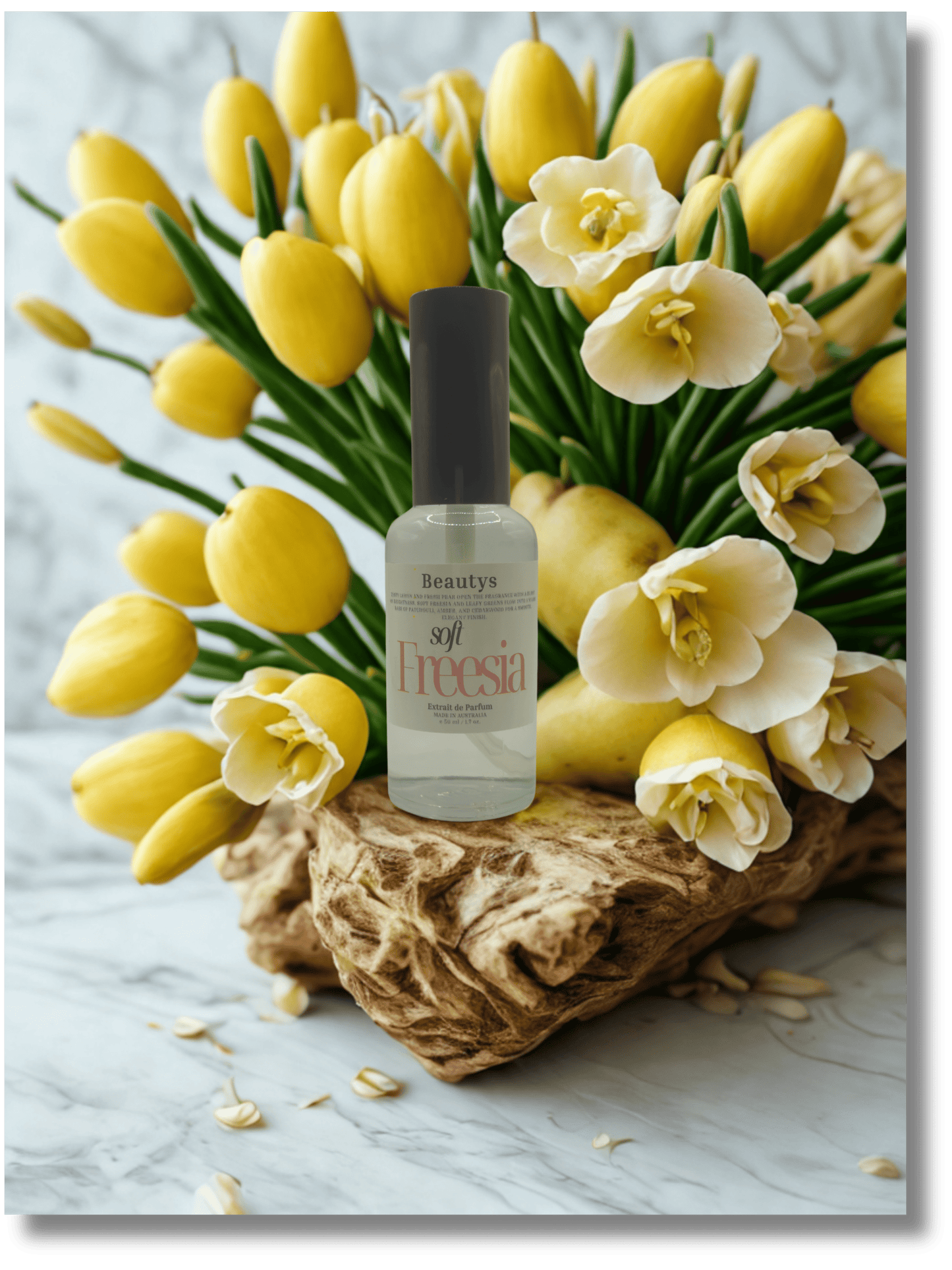 Bottle of beauty product with yellow and white flowers on a marble surface