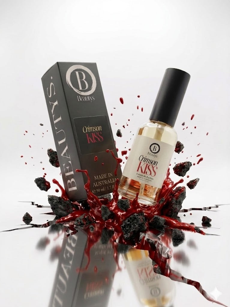 Bottle and packaging of Crimson Kiss perfume with blackberries and red liquid on a white background