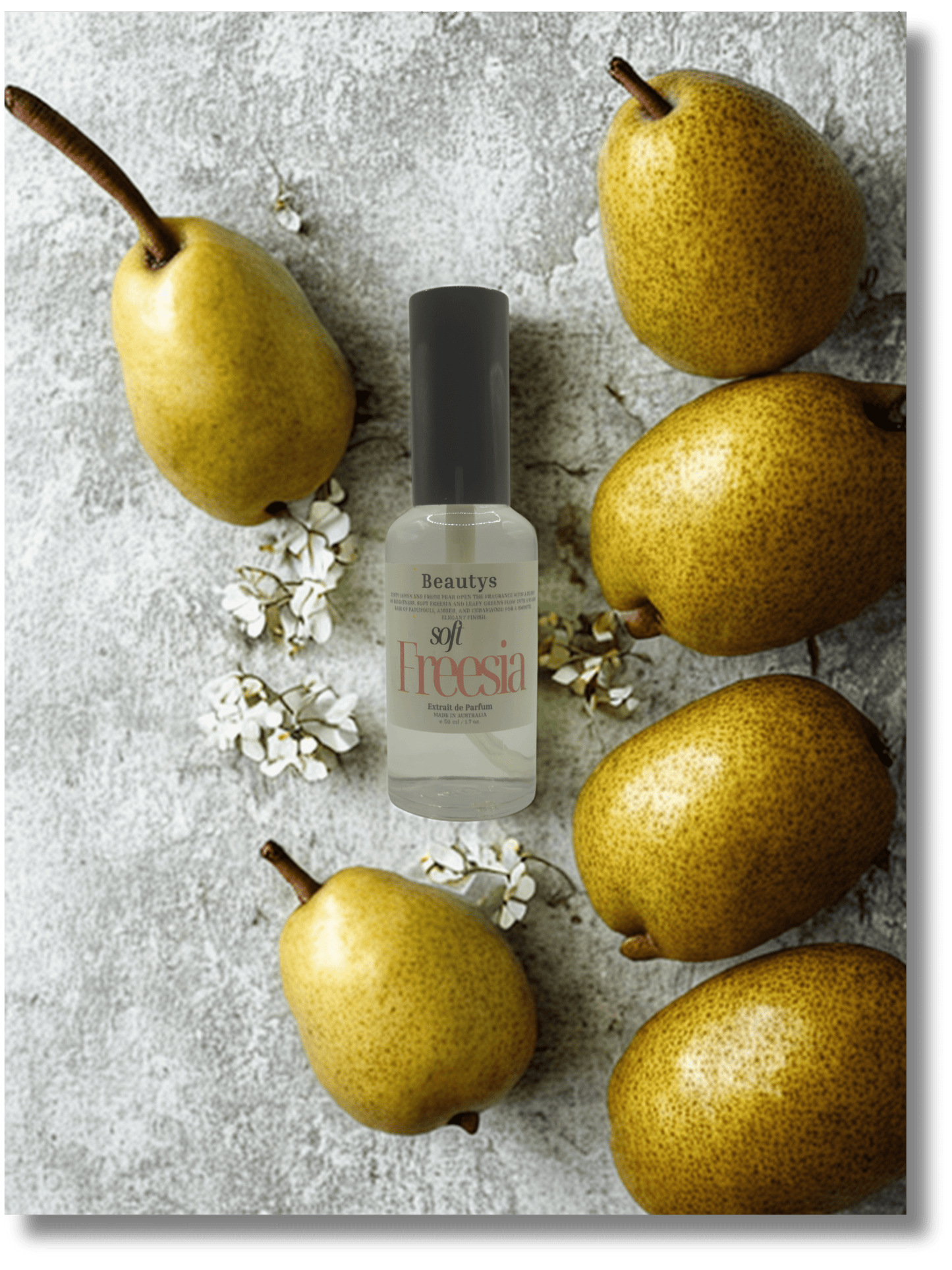 Beauty product bottle with pears and flowers on a textured surface
