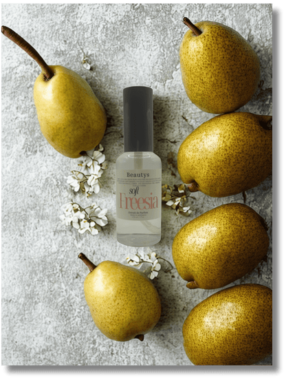 Beauty product bottle with pears and flowers on a textured surface