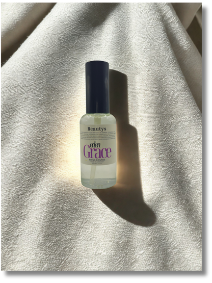 Close-up of Eden Grace perfume bottle, luxury artisan women’s fragrance with jasmine and tuberose.